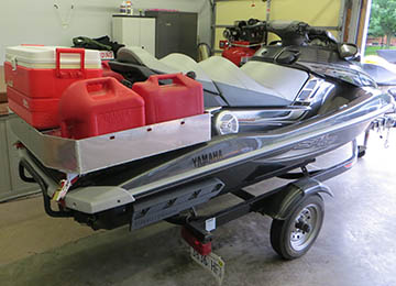 rear quarter view of jetski loaded with extra gas cans and coolers