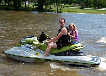 jetskiing with girl behind dad